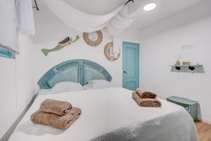 Postel nebo postele na pokoji v ubytování APARTAMENTOS LAGUNA AZUL