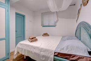 Postel nebo postele na pokoji v ubytování APARTAMENTOS LAGUNA AZUL