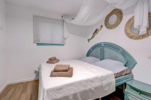 Postel nebo postele na pokoji v ubytování APARTAMENTOS LAGUNA AZUL
