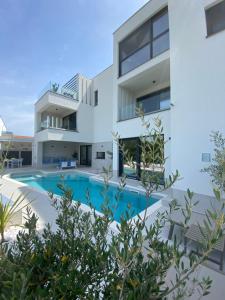an image of a villa with a swimming pool at Villa Burin in Murter