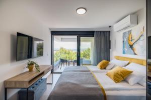 Ένα ή περισσότερα κρεβάτια σε δωμάτιο στο Villa Burin