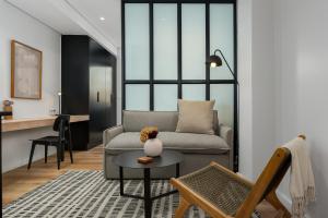 a living room with a couch and a table at The Carrington Aparthotel by Totalstay in Cape Town