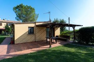 a house with a patio with a table at il Gelso Nero in Ancona