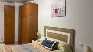 A bed or beds in a room at Can Joan