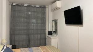 A television and/or entertainment centre at Can Joan