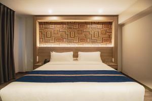 Letto o letti in una camera di Mila Hotel