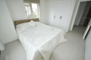 Cama o camas de una habitación en Aguarius Villas