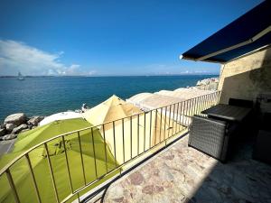 a balcony with a view of the water at SeaHouse Apartments in Piran