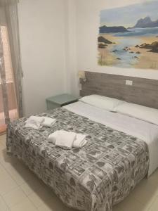 Кровать или кровати в номере Costa Makauda Residence