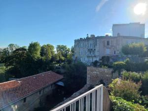 a view of a city with a building and trees at Jonzac Centre Ville - Private Home near Chateau in Jonzac