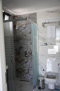 a bathroom with a shower and a toilet at Royal Homes 504 in Antalya