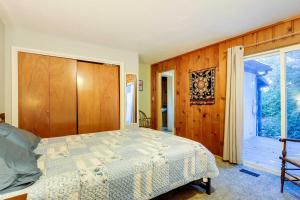 a bedroom with a bed and a window at The Fusion Retreat on 4 Acres Hike On-Site! in White Salmon