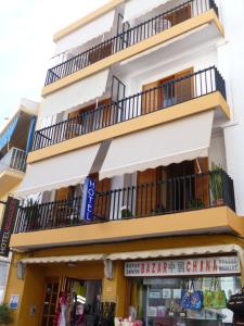 a building with two windows and a balcony at Hotel Buigues in Moraira