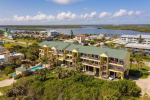 an aerial view of a resort with a body of water at Ocean Club at Turtle Mound 207 in New Smyrna Beach