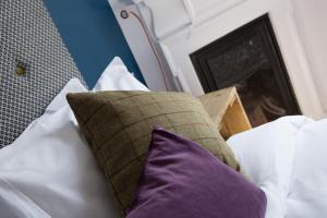Een bed of bedden in een kamer bij The Station Hotel