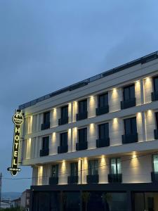 a building with a hotel sign in front of it at Heaven Premium Hotel İstanbul Airport in Arnavutköy