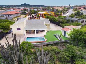 an aerial view of a house with a swimming pool at Happy Daze Villa in Paradera