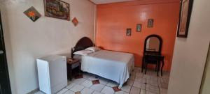 Tempat tidur dalam kamar di Hotel Los Andes Tegucigalpa