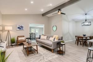 a living room with a couch and a table at The Hiatus, Round Rock, Ideal for Family or Work in Round Rock