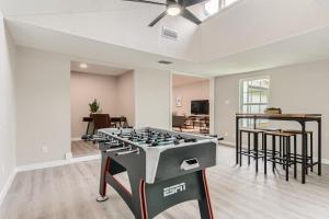 a living room with a foosball table at The Hiatus, Round Rock, Ideal for Family or Work in Round Rock