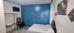 Tempat tidur dalam kamar di Hotel Los Andes Tegucigalpa