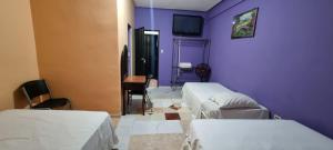 Tempat tidur dalam kamar di Hotel Los Andes Tegucigalpa