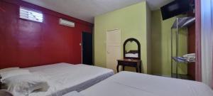 Tempat tidur dalam kamar di Hotel Los Andes Tegucigalpa
