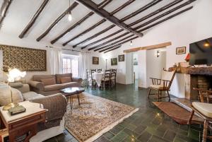 a living room with a couch and a fireplace at Casa do Mar - Golf Jamor in Oeiras