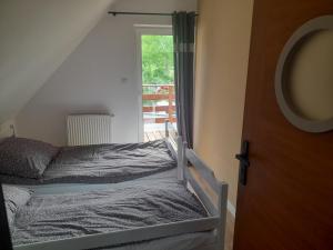 Postel nebo postele na pokoji v ubytování ,,Domek Na Skarpie'' z Balią i basenem letnim + 87 fotografií