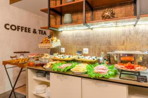 a kitchen with a counter with food on it at LX51 Studios & Suites by APT IIN in Lisbon