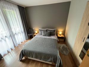 Ένα ή περισσότερα κρεβάτια σε δωμάτιο στο MH Apartments
