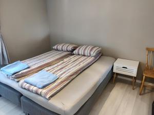 Een bed of bedden in een kamer bij FeelHome apartment Vestregata 52 , 2nd floor