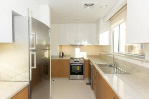 Kuchyň nebo kuchyňský kout v ubytování Urban Oasis Stylish Apartment