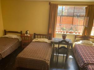 Giường trong phòng chung tại CAYESH Guest House +10 ảnh