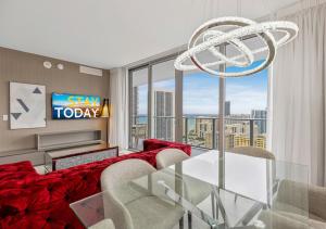 a living room with a glass table and a large window at HYDE BEACH HOUSE #2408 THREE-BEDROOM, WATERFRONT, OCEAN AND INTERCOSTAL VIEW, ROOFTOP POOL, 5 MiN WALK TO BEACH in Hollywood