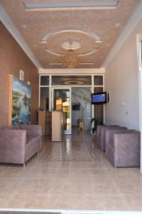 a large lobby with couches and a chandelier at Apartments Fati & Flori in Ulcinj