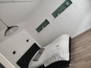 A bed or beds in a room at Contact Hôtel de Matignon