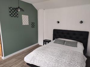 A bed or beds in a room at Contact Hôtel de Matignon