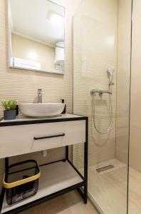 a bathroom with a sink and a shower at Ankica & Anamarija Apartments in Neum +47 photos