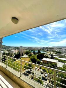 a view of a city from a balcony at Laguna Redonda · Hermoso Departamento con Espectaculares Vistas in Concepción