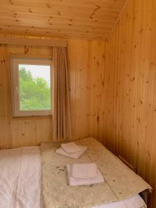 Postel nebo postele na pokoji v ubytování Hotel Okatsia სასტუმრო ოკაცია