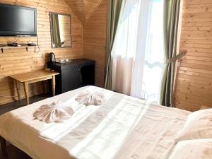 Postel nebo postele na pokoji v ubytování Боброва-Хата