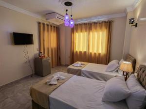 Katil atau katil-katil dalam bilik di Gem Overlooking inn