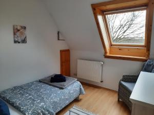 Un pat sau paturi într-o cameră la Ferienhaus Natur und Meer