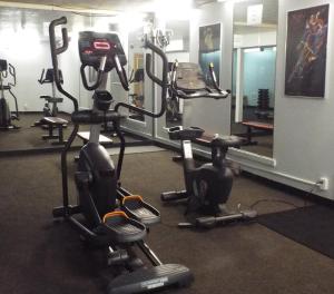 a gym with two exercise bikes and a mirror at Quality Inn Owen Sound in Owen Sound