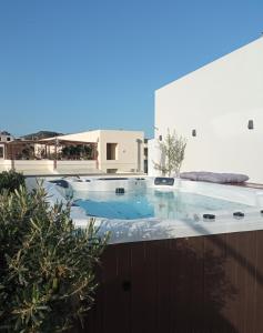 a hot tub on the roof of a building at Elia Platanias in Platanias