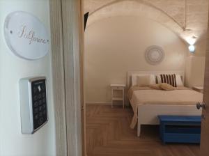 Ένα ή περισσότερα κρεβάτια σε δωμάτιο στο Casa KaLu'