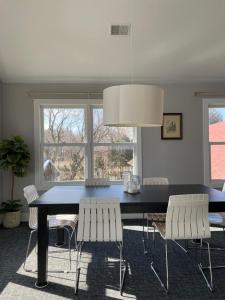 a dining room with a black table and chairs at Blue Star Motel in Douglas