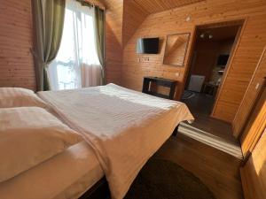 Postel nebo postele na pokoji v ubytování Боброва-Хата