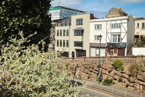 a building on the side of a hill with a street at SoHot Stays Harbourside Suite 2nd Floor Sleeps 4 in Kent